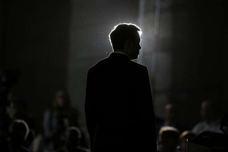 Elon Musk listens as Chicago Mayor Rahm Emanuel talks about constructing a high speed transit tunnel at Block 37 during a news conference on June 14, 2018 in Chicago, Illinois.